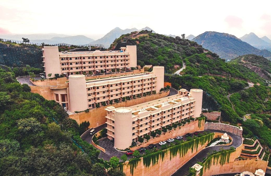 Perceptive Ideas Consulting Engineers Pvt. Ltd., a design-first structural engineering consultancy, has once again demonstrated its expertise through the structural design of Aurika – Luxury by Lemon Tree, Udaipur. Nestled within the rugged Aravalli hills, the project exemplifies the firm’s commitment to integrity, innovation, and professionalism, transforming one of the region’s most challenging terrains into an iconic hospitality landmark.
As the Structural Design Consultant, Perceptive Ideas addressed the steep gradients, undulating contours, and variable geological strata of the Aravallis. Instead of extensively reshaping the hills, the team adopted a terraced structural planning approach, enabling the built form to blend naturally with the landscape. This strategy preserved slope stability, minimized excavation, and maintained architectural harmony.
Given the complex geology—characterized by weathered rock, inconsistent SBC pockets, and local shear zones—the firm developed a comprehensive piling strategy. This included deep piles, isolated and combined pile caps on steep slopes, rock-socketed piles where refusal strata existed, and rigorous pile load and integrity testing. These measures ensured uniform load distribution and long-term structural performance across varying site elevations.
Hill stabilization was another critical focus. The team implemented engineered granular backfilling, touch piles for vertical members, retaining structures with shear keys, and geogrid-based soil confinement. Extensive retaining systems, including counterfort RCC walls, soil-nailed solutions for deep cuts, staged excavation, and robust drainage mechanisms, were employed to mitigate hydrostatic pressure and ensure slope stability throughout construction.
Terrain-driven solutions extended to the superstructure as well. Voids were created between column foundations to avoid unnecessary soil filling, column spacing was optimized to minimize hill disturbance, and columns were strategically placed to reduce pile dependency. Every decision emphasized safety, constructability, and alignment with architectural intent.
Reflecting on the project, Mr. Ajay Gupta, Principal Consultant & Founder of Perceptive Ideas, said,
"Aurika Udaipur is a testament to engineering that respects and responds to nature. Designing amidst the Aravallis was a challenge that demanded precision, sensitivity, and innovation. We aimed to create a strong structure that harmonizes with its surroundings, and we are proud to have delivered a landmark that embodies resilience and elegance."
Carved into the Aravalli hills, Aurika Udaipur now stands as a remarkable feat of engineering, defined by meticulous analysis, state-of-the-art construction techniques, and unwavering commitment to long-term safety and performance. Through every structural intervention aligned to architectural vision, Perceptive Ideas has set a new benchmark for hillside hospitality engineering in India.